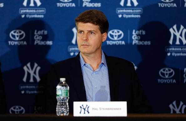 Yankees owner Hal Steinbrenner speaks at a press conference.