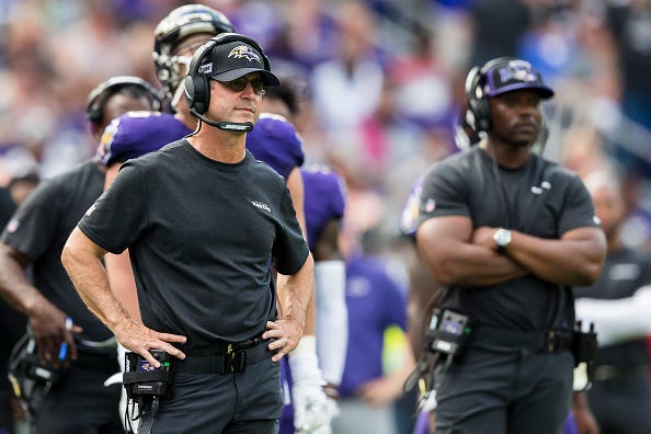 John Harbaugh looks on from the Ravens sideline.