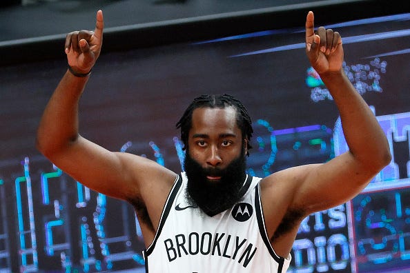 James Harden celebrates a shot with the Nets.