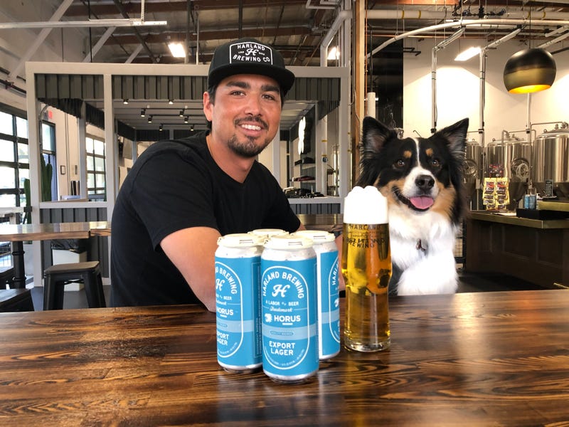 Harland Head Brewer Ryan Alvarez and Koda share a Harland Export Lager