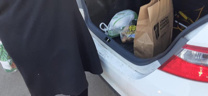Car's trunk full of Thanksgiving food from Union Gospel Mission