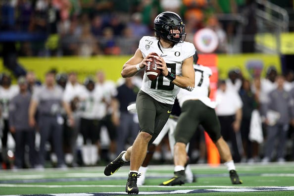 Oregon QB Justin Herbert looks to make a throw against Auburn.
