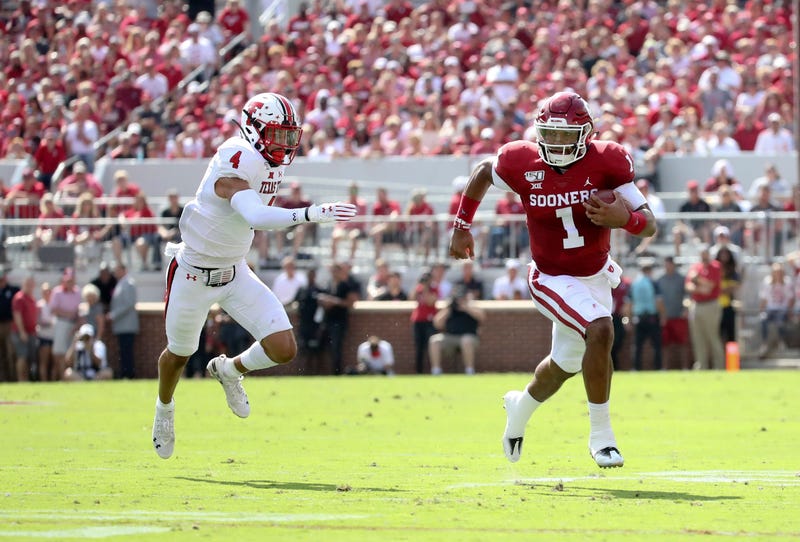 Oklahoma QB Jalen Hurts rushes for yardage against Texas Tech.