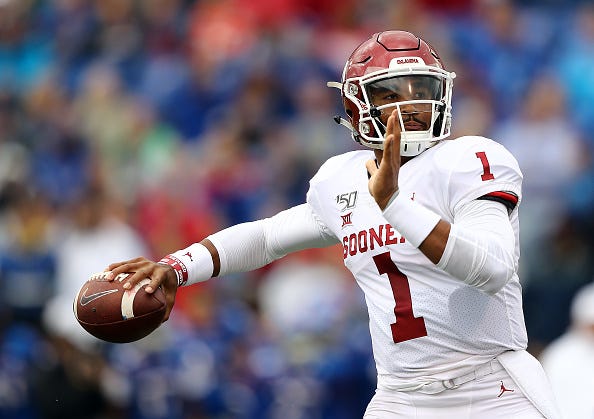 Oklahoma QB Jalen Hurts looks for a receiver downfield.