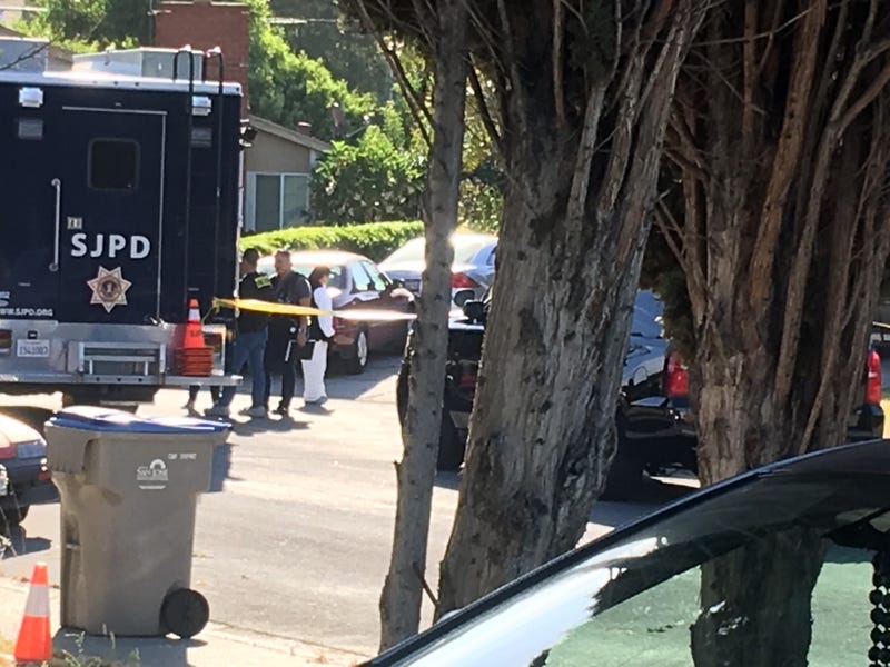 A crime scene technician is in front of a San Jose home where police say four people were killed by a gunman who also took his own life on June 23, 2019.