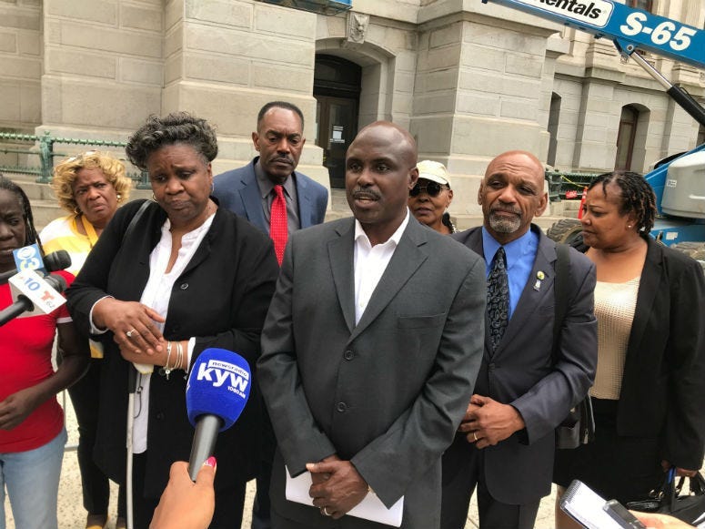 Rally for Justice Coalition talking to reporters.