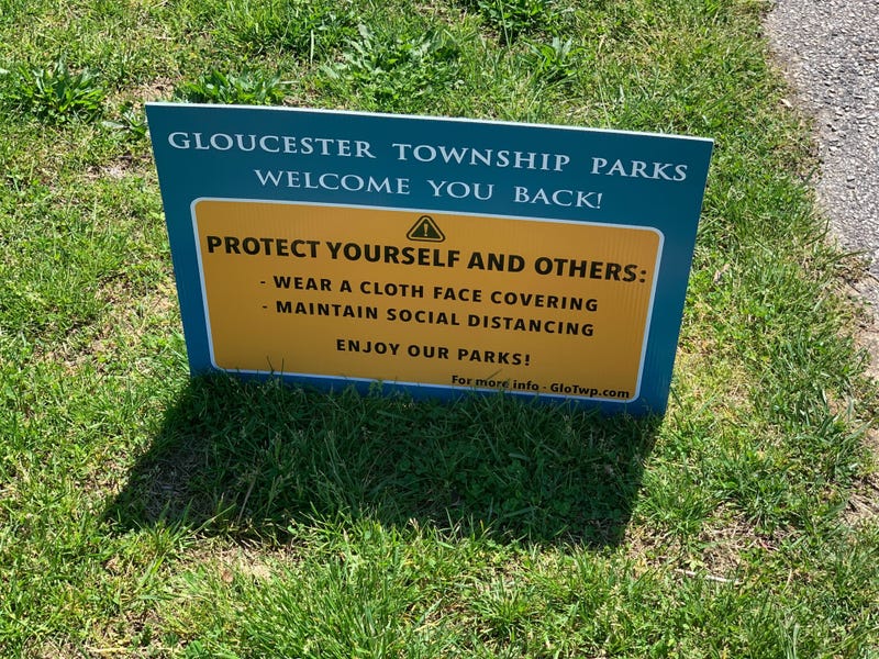 A sign at a Gloucester Township park welcoming people back, as parks and golf courses in New Jersey reopened Saturday, with strict social distancing requirements.