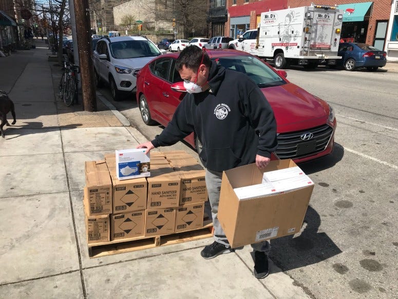 Andy Siegel with a box N95 filtration masks.