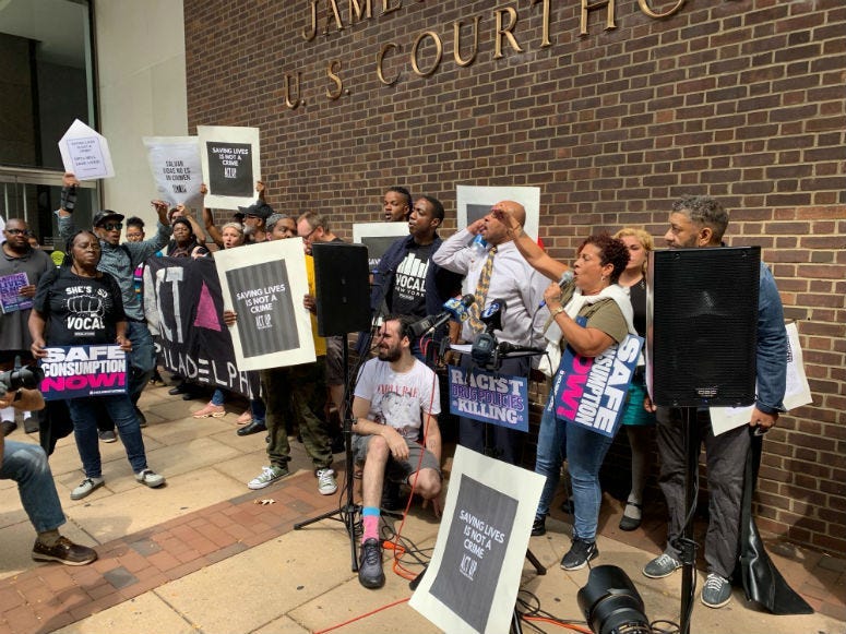People gathered in front of the court house.
