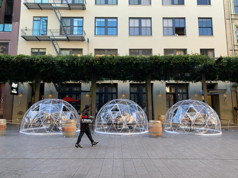 Igloo-like plastic dining bubbles line San Francisco's Mint Plaza outside sushi eatery Hashiri.