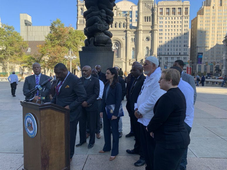 City Controller Rebecca Rhynhart stands with other elected officials.