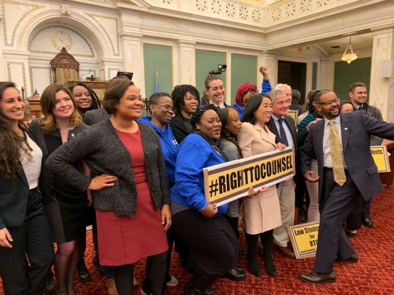 Councilmember Helen Gym poses with advocates in Philadelphia City Council.
