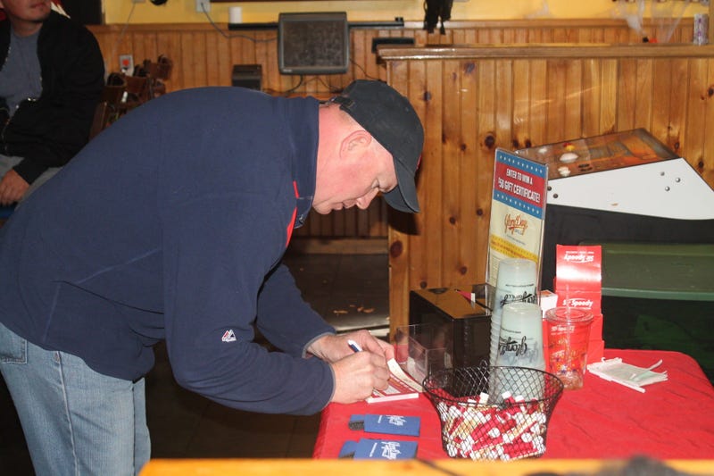 JP and Cakes from The Sports Junkies as well as 106.7 The Fan Street Team, chats with Skins fans at Glory Days Grill in Centreville, Va before kickoff.