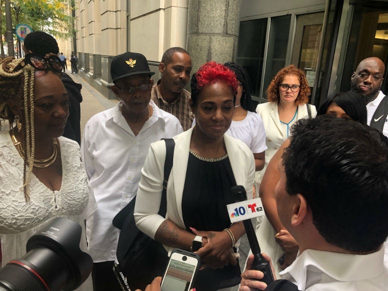 Ketra Veasy, Willie Veasy's sister at the court giving an interview.