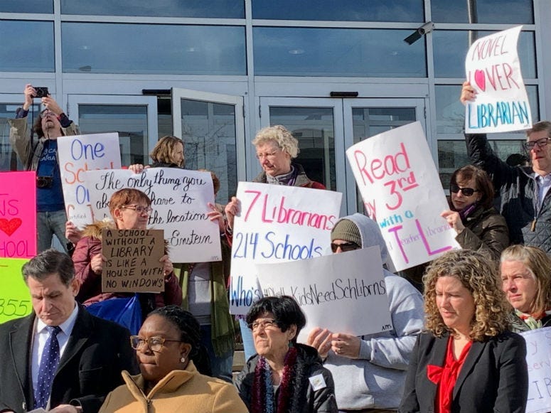 Educators rallied on the steps of Philadelphia School District headquarters, calling on schools to restore librarians to schools.
