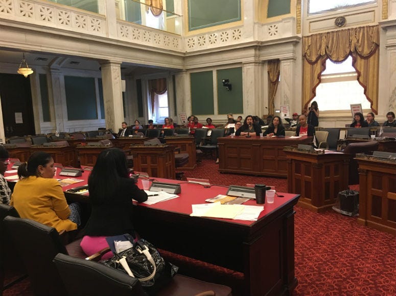 Advocate Erika Almirante, Janet Ginsberg of Community Legal Services and Allison Julian of the Domestic Workers Alliance testify.
