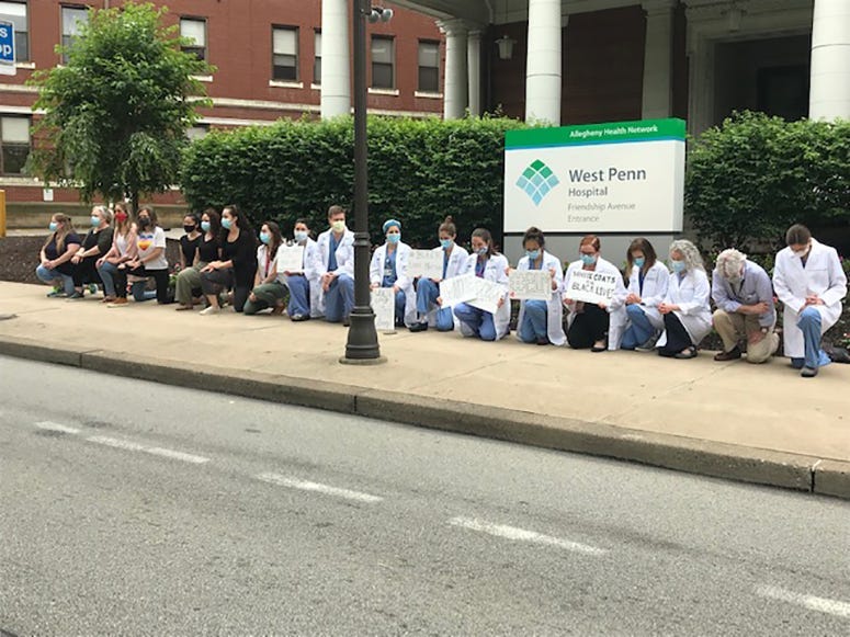Allegheny Health Network Staff Take A Knee Outside West Penn Hospital