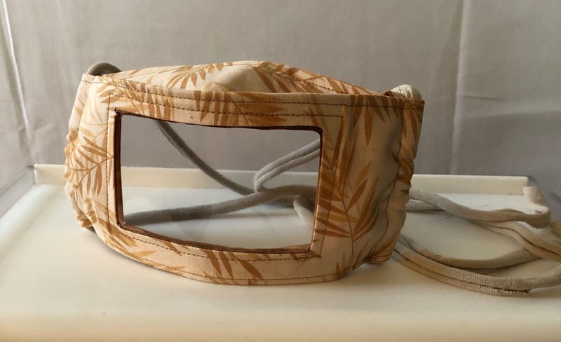 A transparent face mask for the deaf