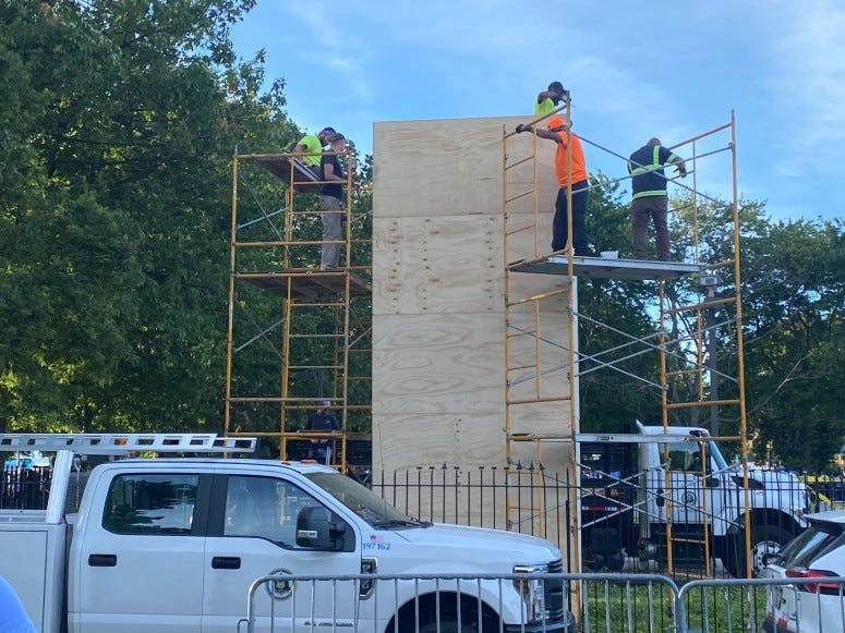 Crews box up the Christopher Columbus statue in South Philadelphia