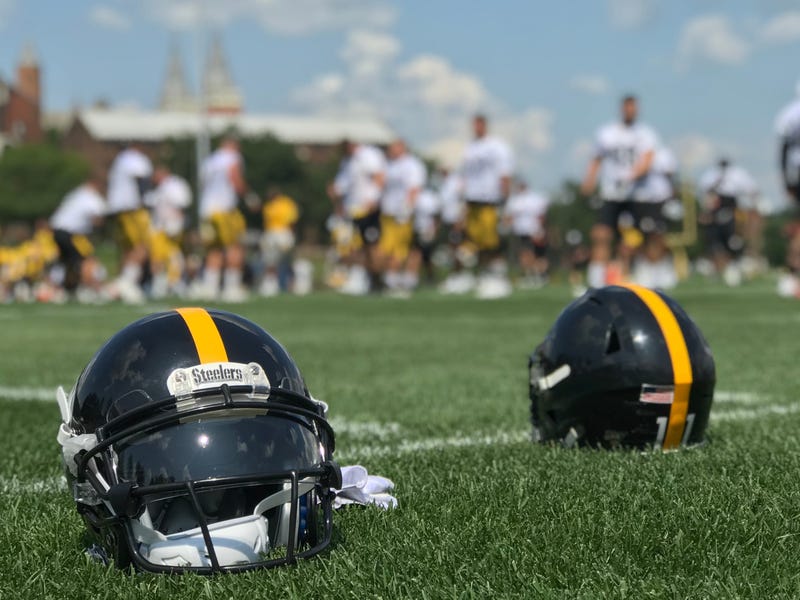 Steelers helmets on the field at Saint Vincent College in 2019 training camp