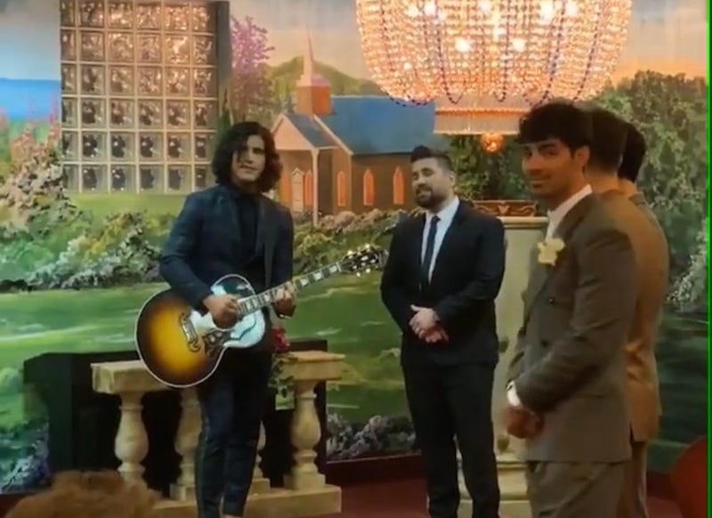 Dan + Shay perform during Joe Jonas & Sophie Turner's wedding