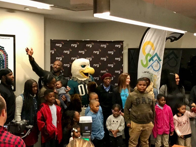 Families find out they win a scholarship at Lincoln Financial Field.