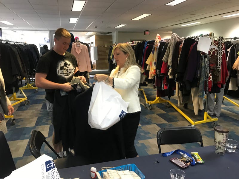 Danielle McNichol, director of Neumann University's center for leadership, helps outfit young people through the "Wardrobes for Work" program.
