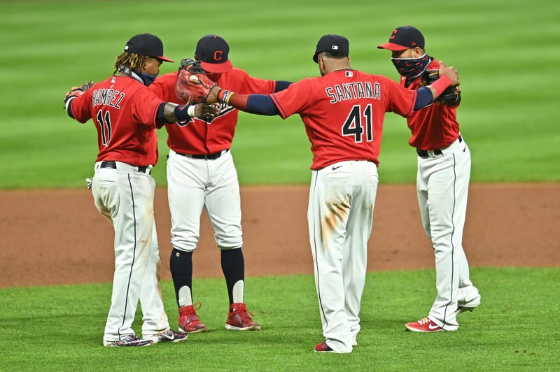Cleveland Indians third baseman Jose Ramirez (11) and shortstop Francisco Lindor (12) and first baseman Carlos Santana (41) and second baseman Cesar Hernandez (7) celebrate after the Indians beat the Cincinnati Reds at Progressive Field