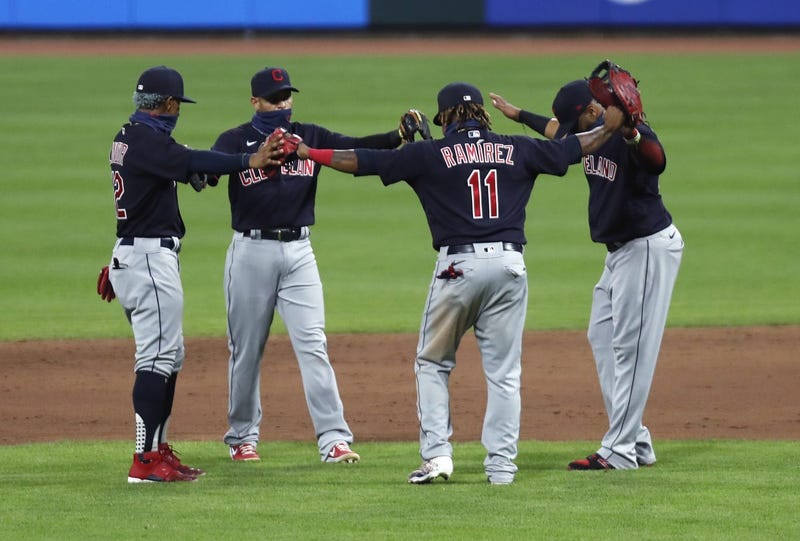 Cleveland Indians third baseman Jose Ramirez (11) reacts with teammates after the Indians defeated the Cincinnati Reds at Great American Ball Park.
