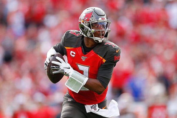 Bucs QB Jameis Winston scrambles while keeping his eyes downfield.