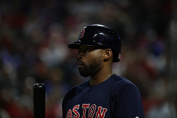 Red Sox OF Jackie Bradley Jr. looks out to the pitcher before an at-bat.