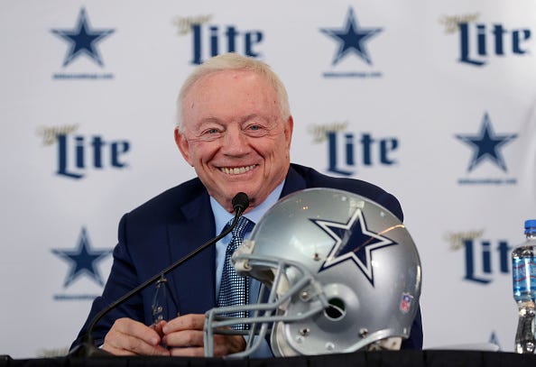 Jerry Jones smiles at a Cowboys press conference.