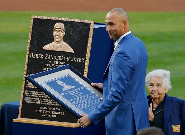 Derek Jeter has a plaque presented to him by the Yankees in 2017.