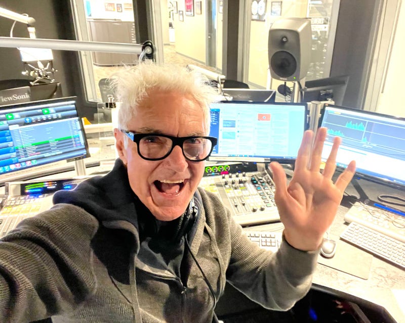 John Fisher waving in front of the console in the 94.1 The Sound studio