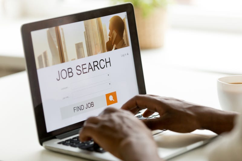 Person browsing work online using job search computer app