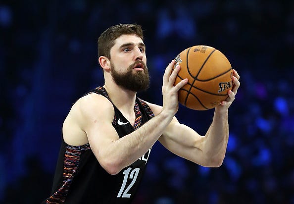 Joe Harris competes in the 3-point shooting contest