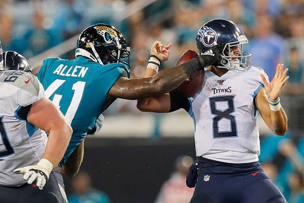 Jaguars' Josh Allen knocks the ball loose out of Ryan Tannehill's hands.