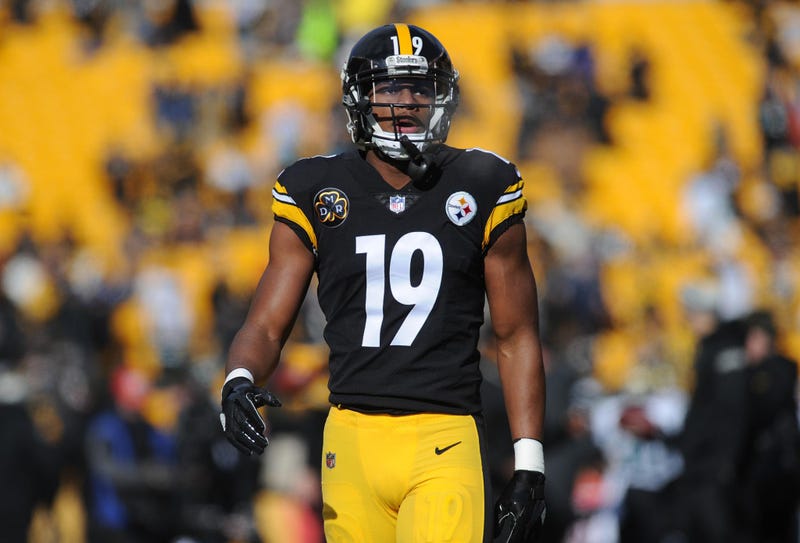 Pittsburgh Steelers wide receiver JuJu Smith-Schuster (19) lays on the field from an injury during the first quarter against the Cleveland Browns at FirstEnergy Stadium.