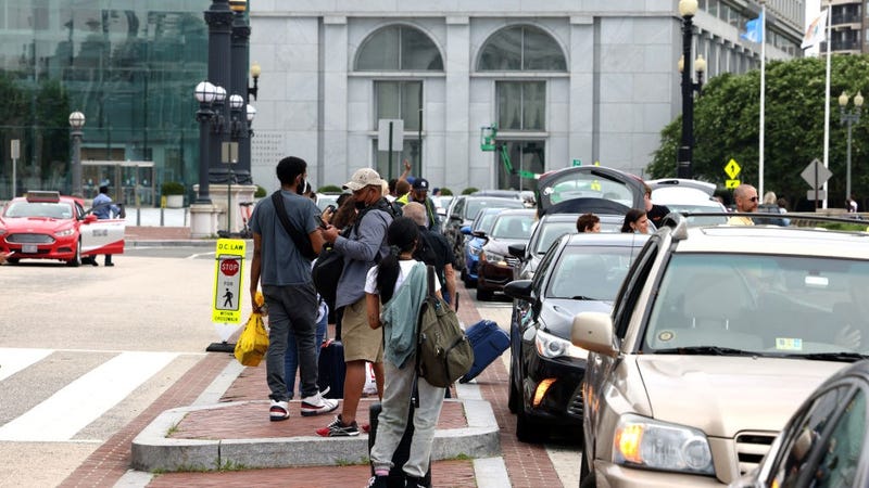 People wait for rideshare cars at Union Station on July 02, 2021 in Washington, DC.
