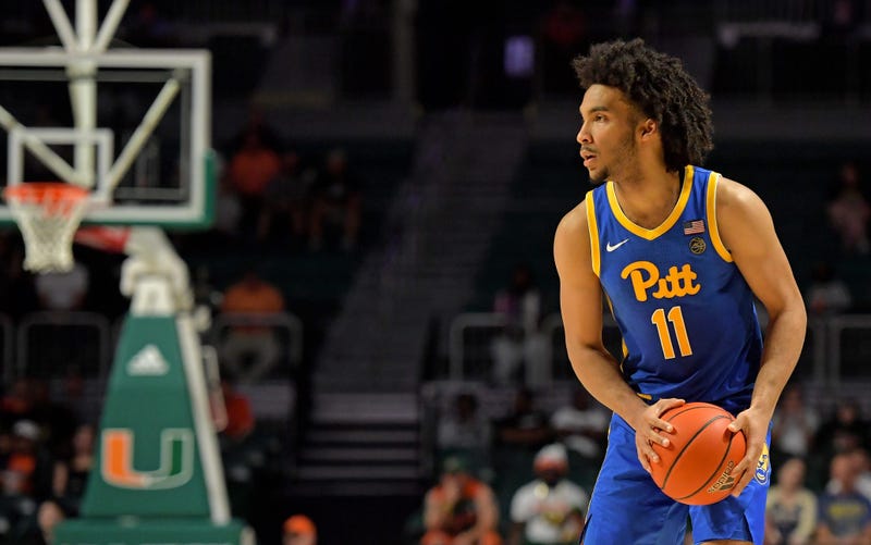 Pittsburgh Panthers guard Justin Champagnie (11) looks to pass against the Miami Hurricanes during the first half at Watsco Center.