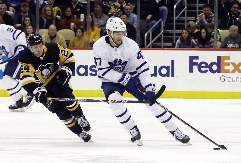 Toronto Maple Leafs left wing Pierre Engvall (47) skates with the puck against pressure from Pittsburgh Penguins center Dominik Kahun (24) during the third period at PPG PAINTS Arena. Pittsburgh won 5...