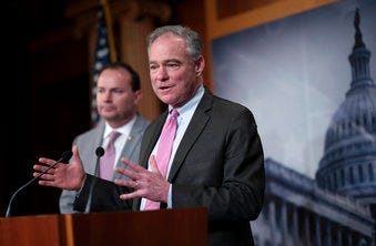 Sen. Tim Kaine, joined at left by Sen. Mike Lee, just after the Senate advanced a resolution asserting that President Trump must seek approval from Congress before engaging in further military action against Iran. (AP Photo/J. Scott Applewhite)