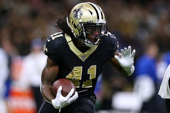 Saints RB Alvin Kamara braces for a hit behind the line of scrimmage.