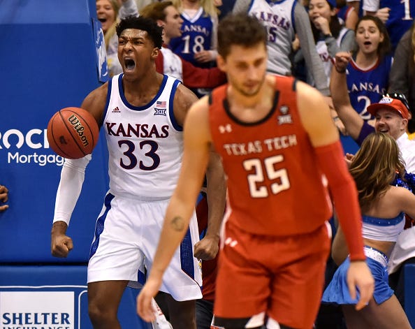 David McCormack of Kansas roars after throwing down a dunk.