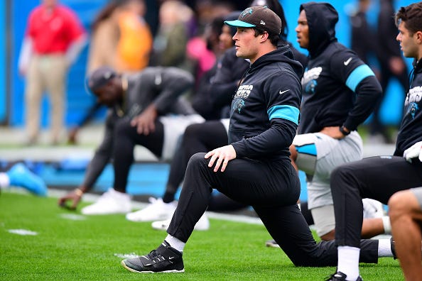 Luke Kuechly stretches during a 2019 Panthers practice.