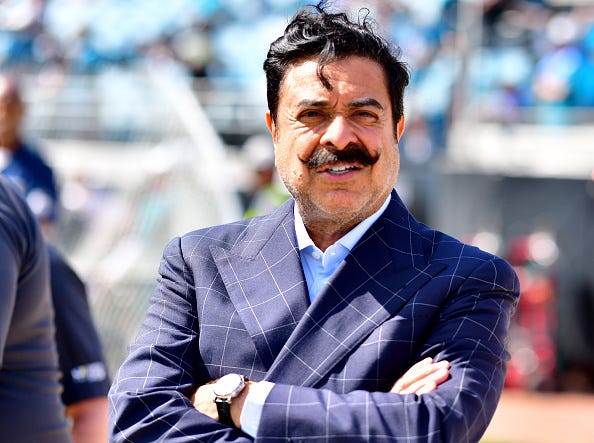 Jaguars owner Shahid Khan on the field before a game.