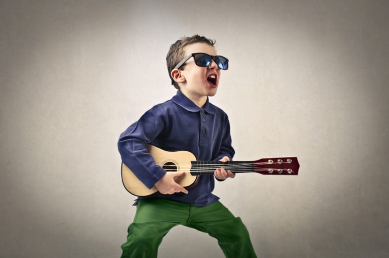 Kid_Playing_Guitar