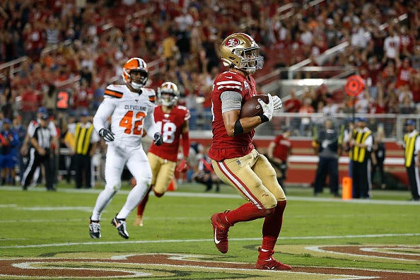 49ers TE George Kittle celebrates a touchdown against the Browns.