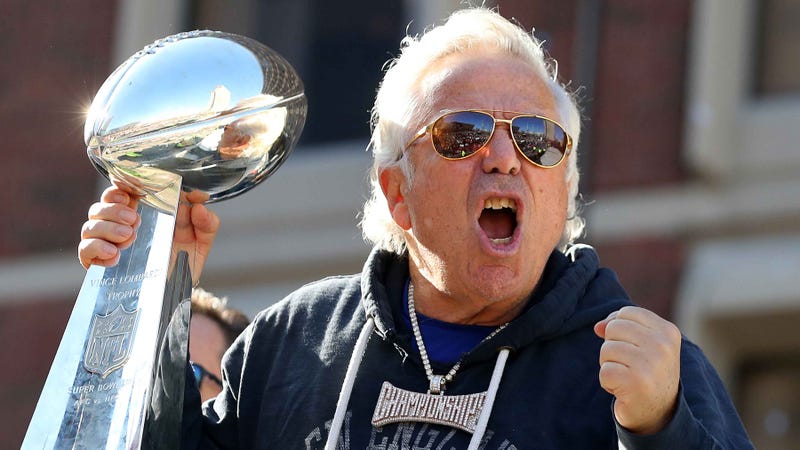 Robert Kraft holds the Lombardi Trophy aloft at the New England Patriots' Super Bowl parade in 2019.