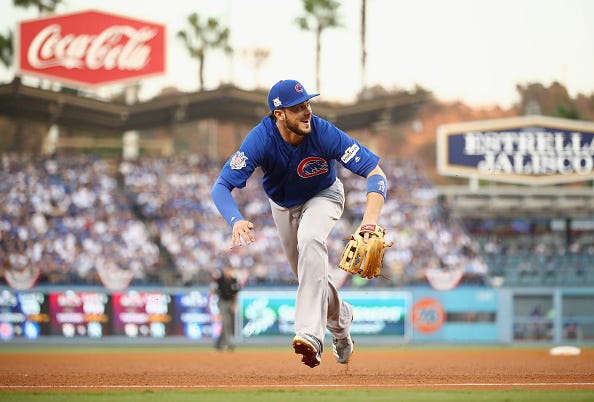 Kris Bryant fields a ball at third base against the Dodgers.